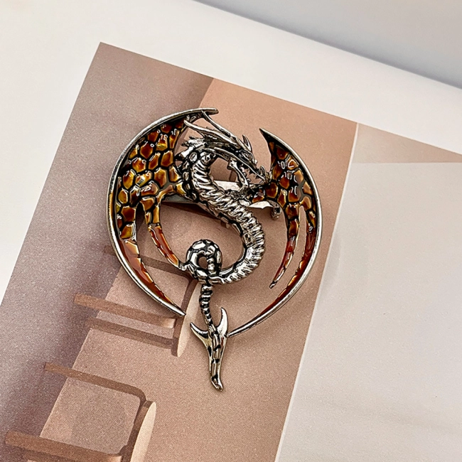 брошка с драконом
