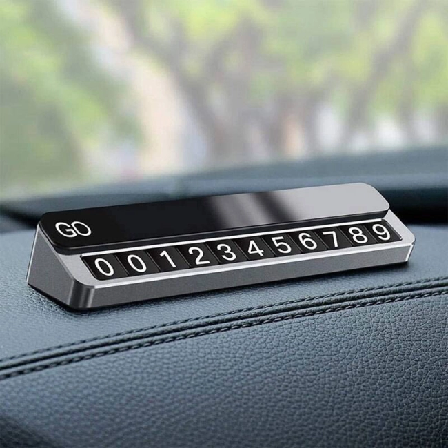 візитка з номером телефону до машини